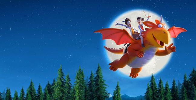An animated orange dragon flies in the night sky with two doctors riding on his back