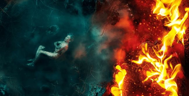 A woman submerged in blue ice on the left side and red fire on the right side.