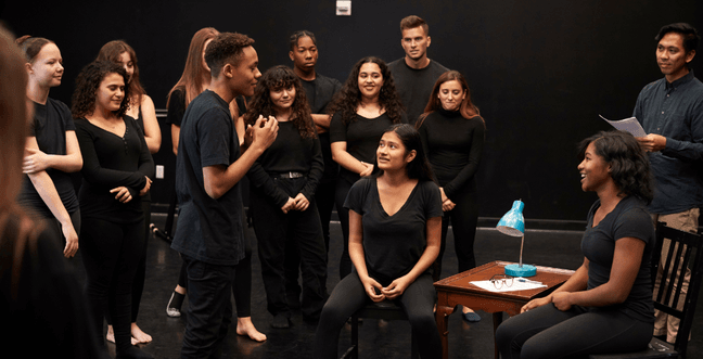 A group of people in a rehearsal room
