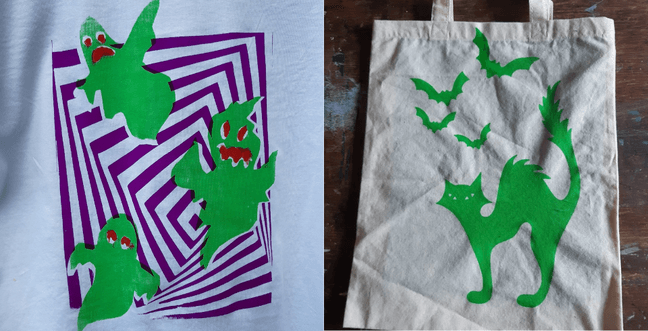 A bag with ghosts printed in green with purple lines in a pattern next to a bag with a green cat on the front